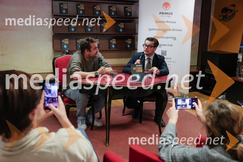  Anže Tomič;  Jure Godler, televizijski voditeljDruženje z Juretom Godlerjem ob izidu romana Naš človek v kafani