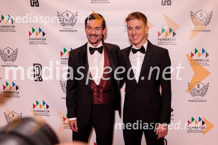  Primož Roglič, kolesar;  Tadej Pogačar, kolesarPrimož Roglič predal naziv botra, dobrodelna prireditev Olimpijskega komiteja Slovenije