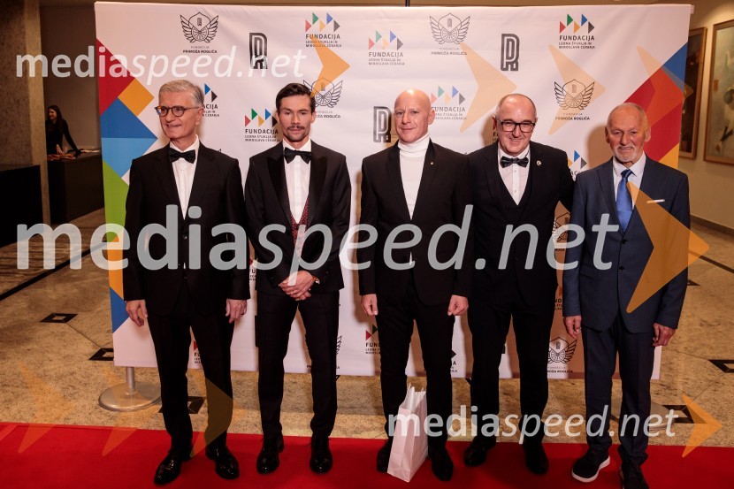  Franjo Bobinac, podpredsednik in generalni direktor za globalni marketing, Hisense International., predsednik Rokometne zveze Slovenije;  Primož Roglič, kolesar;  ... ;  ... ;  Miroslav Cerar, nekdanji gimnastičar, nekdanji predsednik Odbora za podeljevanje Bloudkovih priznanjPrimož Roglič predal naziv botra, dobrodelna prireditev Olimpijskega komiteja Slovenije