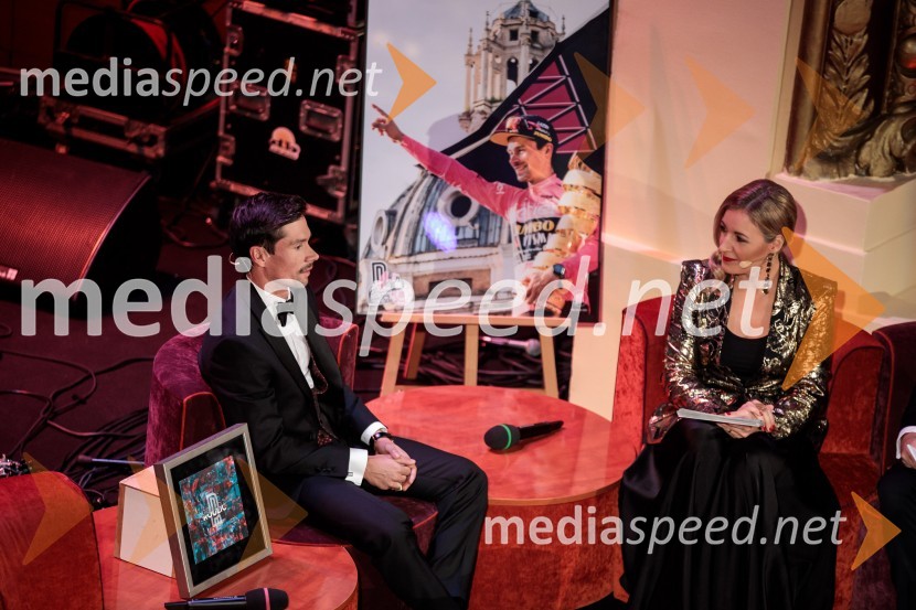  Primož Roglič, kolesar;  ... Primož Roglič predal naziv botra, dobrodelna prireditev Olimpijskega komiteja Slovenije