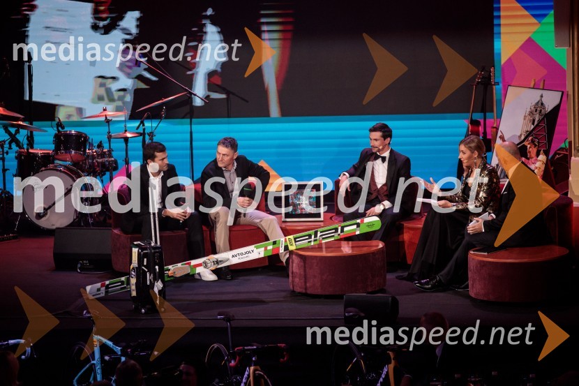  Robert Hrgota, trener slovenske skakalne reprezentance;  Zvone Pograjc;  Primož Roglič, kolesar;  ... ;  ... Primož Roglič predal naziv botra, dobrodelna prireditev Olimpijskega komiteja Slovenije