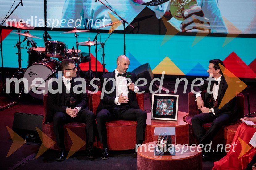  ... ;  Luka Mezgec, kolesar;  Primož Roglič, kolesarPrimož Roglič predal naziv botra, dobrodelna prireditev Olimpijskega komiteja Slovenije