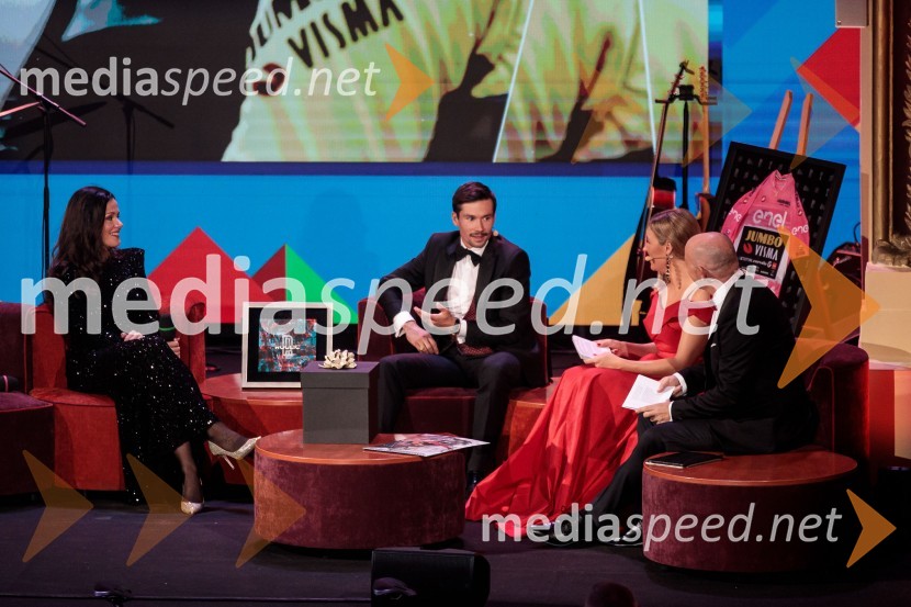  Lora Roglič Klinc;  Primož Roglič, kolesar;  ... ;  ... Primož Roglič predal naziv botra, dobrodelna prireditev Olimpijskega komiteja Slovenije