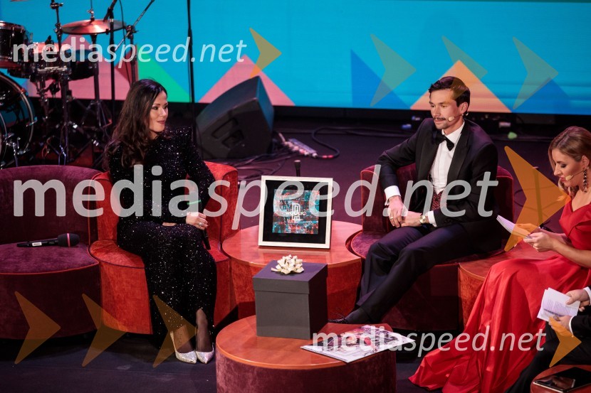  Lora Roglič Klinc;  Primož Roglič, kolesarPrimož Roglič predal naziv botra, dobrodelna prireditev Olimpijskega komiteja Slovenije