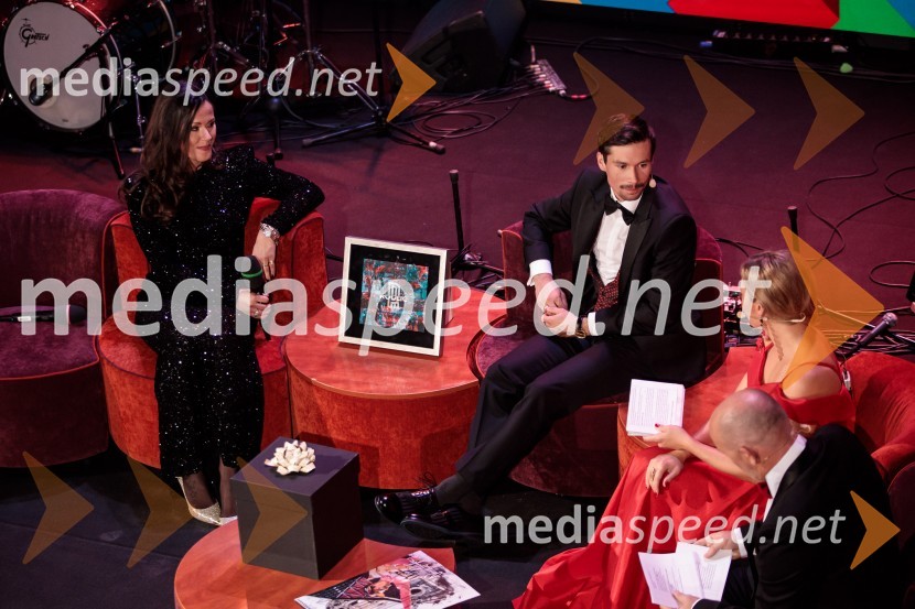  Lora Roglič Klinc;  Primož Roglič, kolesar;  ... Primož Roglič predal naziv botra, dobrodelna prireditev Olimpijskega komiteja Slovenije