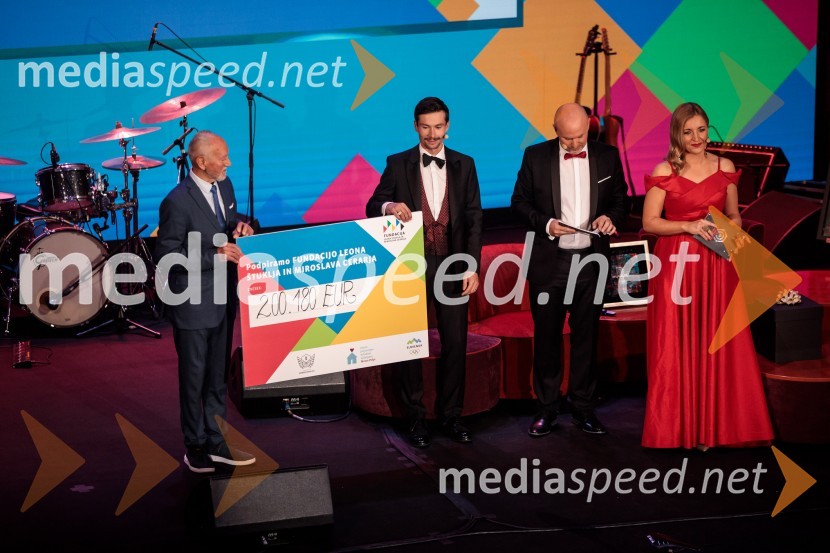  Miroslav Cerar, nekdanji gimnastičar, nekdanji predsednik Odbora za podeljevanje Bloudkovih priznanj;  Primož Roglič, kolesar;  ... ;  ... Primož Roglič predal naziv botra, dobrodelna prireditev Olimpijskega komiteja Slovenije