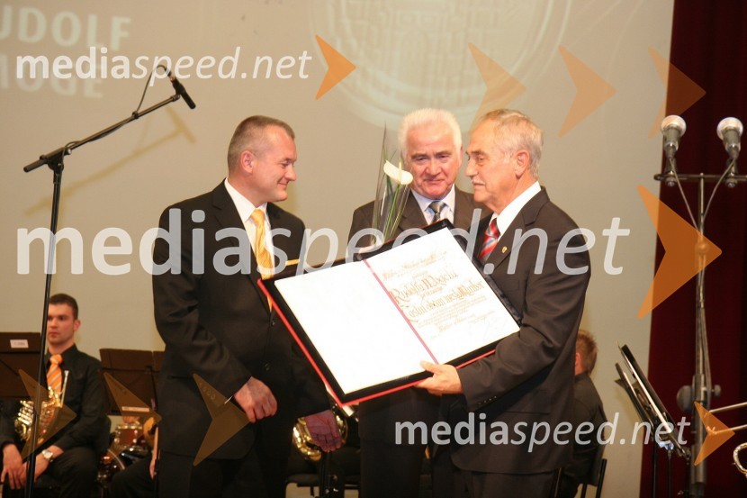 Franc Kangler, župan Mestne občine Maribor, Karl Midlil, predsednik Komisije mestnega sveta Mestne občine Maribor za priznanje in nagrade in Rudi Moge, nekdanji poslanec DZ in predsednik sveta SNG Maribor ter prejemnik priznanja častni občanPodelitev priznanj Mestne občine Maribor za leto 2009 in razglasitev častnega občana