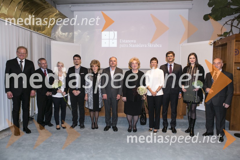  Janez  Škrabec, direktor Riko d.o.o., predsednik Slovensko-ruskega poslovnega sveta, predsednik Lions kluba Ljubljana Iliria; dr. Edvard Kovač, teolog in filozof, član uprave Škrabčeve ustanove;  Urška Vranjek Ošlak, štipendistka Škrabčeve ustanove;  Janoš Ježovnik, štipendist Škrabčeve ustanove; prof. dr. Irena Stramljič Breznik, Filozofska fakulteta, Univerza v Mariboru, članica strokovne komisije Škrabčeve ustanove; prof. dr. Marko Snoj, predsednik strokovne komisije Škrabčeve ustanove; prof. dr. Alenka Šivic Dular, jezikoslovka, slavistka, nagrajenka Škrabčeve ustanove; prof. dr. Maja Makovec Brenčič, ministrica za izobraževanje, znanost in šport;  Matjaž Rakovec, predsednik, Ustanova patra Stanislava Škrabca;  Irena Kužnik, štipendistka Škrabčeve ustanove;  Doku Gapurovič Zavgajev, veleposlanik Ruske federacije v SlovenijiPodelitev nagrad in štipendij Škrabčeve ustanove 2015