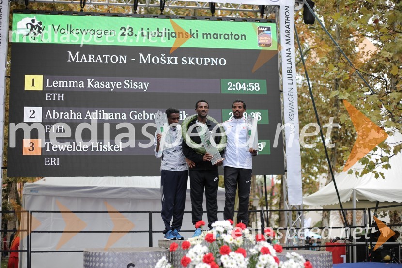  Abraha Adihana Gebretsadik, tekač;  Lemma Kasaye Sisay, tekač;  Tewelde Hiskel, tekačNa 23. ljubljanskem maratonu slavila Etiopijec in Kenijka