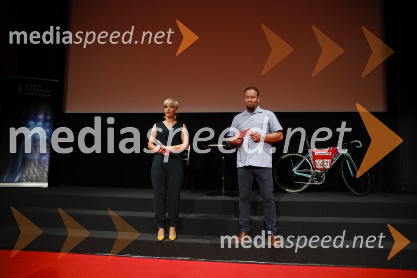  Katarina Braniselj, voditeljica, Planet 18;  ... Predpremiera dokumentarnega filma Moja pot na dirko po Franciji in predstavitev knjige Kilometer nič