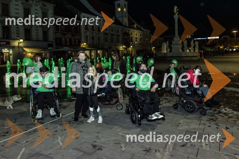  ... ; mag. Helena  Kujundžić Lukaček, podžupanja Mestne občine Maribor;  ... ;  ... ;  ... Zeleno obarvan Mariborski grad in fontana na Glavnem trgu ob svetovnem dnevu cerebralne paralize