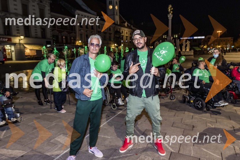  Rok Vilčnik, pesnik, dramatik, glasbenik;  Boštjan Čukur, raper, 6 Pack ČukurZeleno obarvan Mariborski grad in fontana na Glavnem trgu ob svetovnem dnevu cerebralne paralize